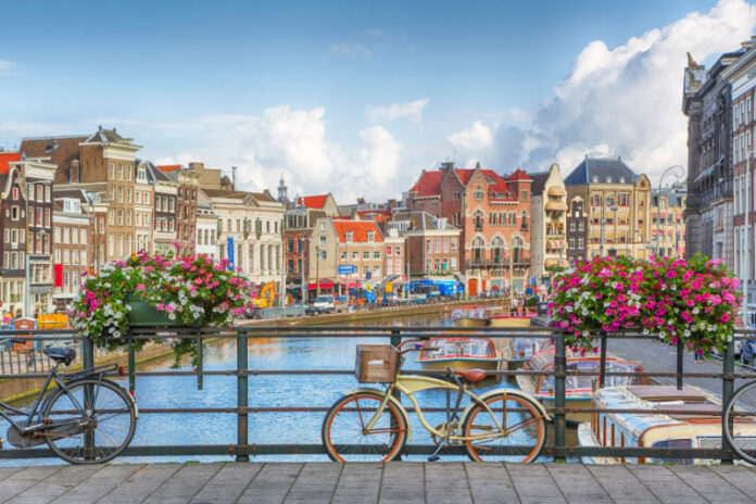 Amsterdam's new tourist vision: flowery bikes, eco-living, and diversity